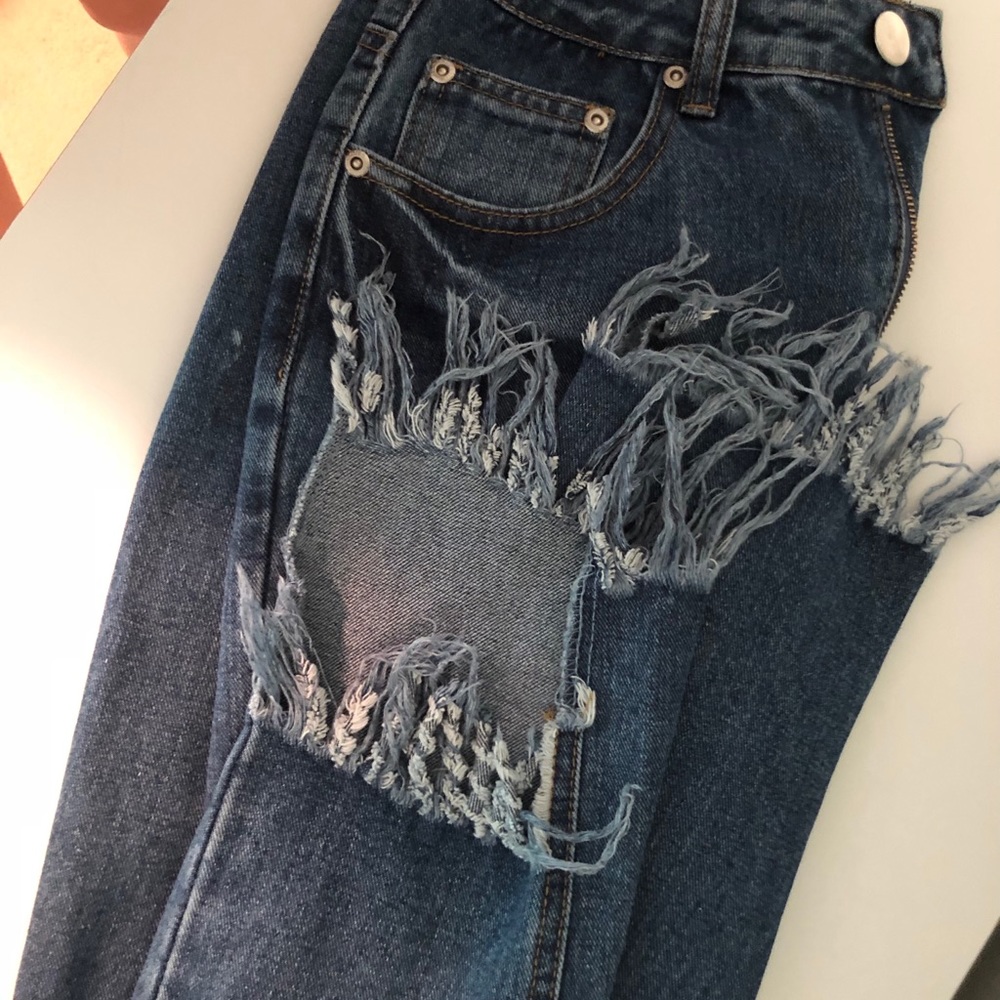 Denim jeans with fray detail.